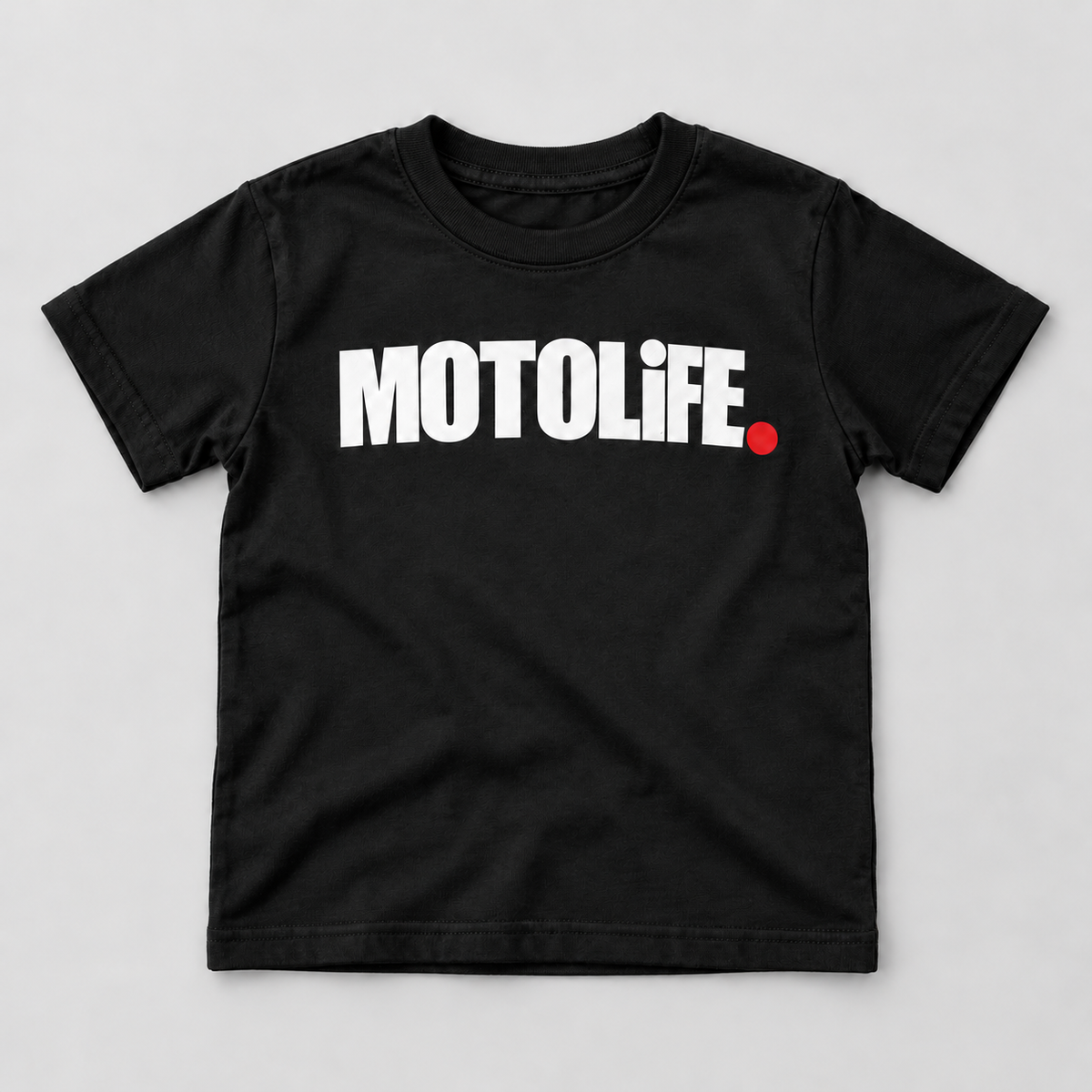 Black MOTOLiFE kids tee front flat-lay mockup with white chest wordmark and red period