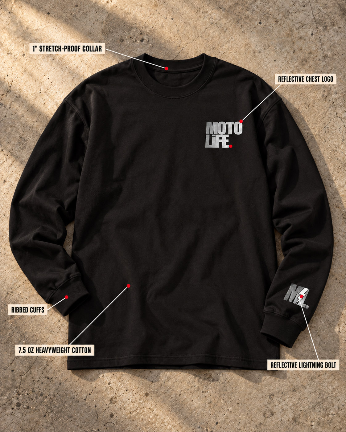 MOTOLiFE V2 black long-sleeve T-shirt front flat lay on concrete. Callouts identify the 1-inch stretch-proof collar, ribbed cuffs, 7.5 oz heavyweight cotton, reflective chest logo and reflective sleeve lightning bolt.