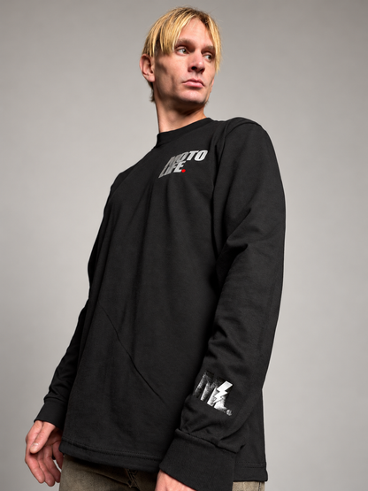 MOTOLiFE NiGHT SHiFT V2 black long sleeve T-shirt detail showing the reflective ML lightning mark, sleeve hem and cotton fabric texture.